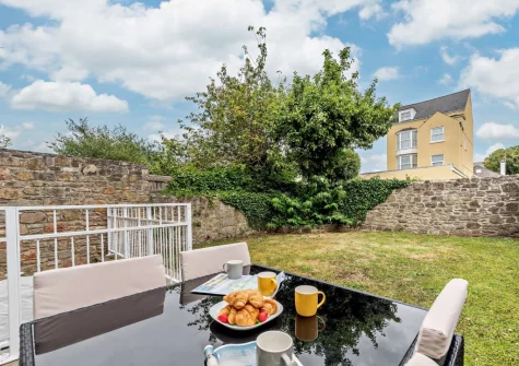 The patio, alfresco dining area & garden at 2 Caldey View, Tenby