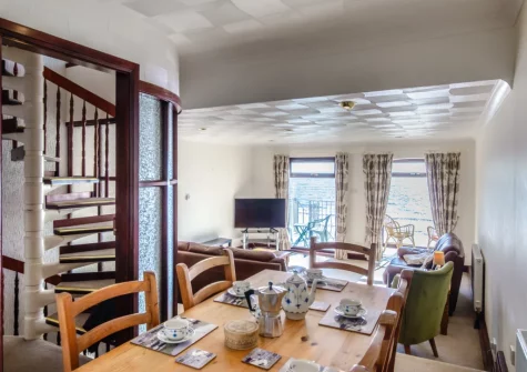 The living & dining area and stairs up to the first floor at 2 Mariners Reach, Saundersfoot