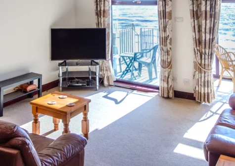 2 Mariners Reach, Saundersfoot is a beachfront house with direct garden access to golden sands, spectacular sea views from multiple rooms, a private patio with barbecue, and within strolling ditance of the village's shops, pubs, and restaurants.