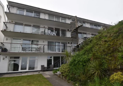 22 Beach Court is a second-floor apartment with balcony offering beautiful sea views