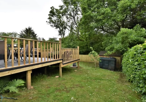 The decked patio with outdoor sitting area & garden at 3 Clos Yr Ysgol, Stepaside