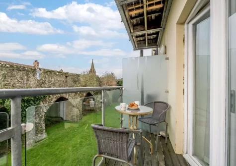 The small decked terrace, outdoor sitting area & sharden garden at 3 Cobourg House, Tenby