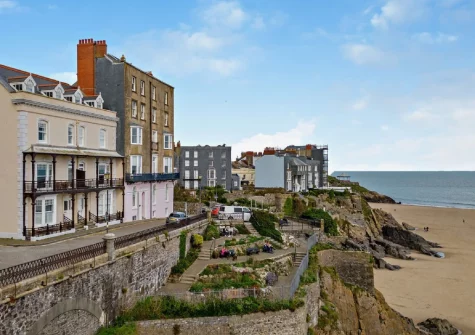 Steps opposite the apartment building lead directly to Tenby's scenic, cliff-backed sandy Castle Beach