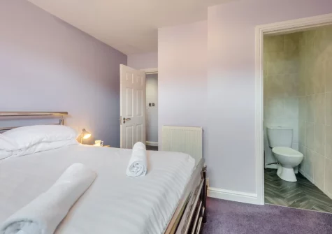 Bedroom #1 & en-suite shower room at 3 White Rose, Tenby