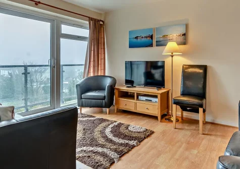 31 Croft Court, Tenby is a charming three-bedroom apartment with breathtaking views over the town and direct beach access. Discover inviting interiors, a shared garden, and the perfect base for creating lasting memories with family and friends.