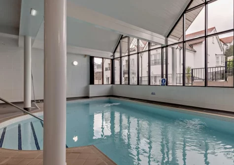 The shared heated indoor swimming pool at 4 Bryn Y Mor, Tenby
