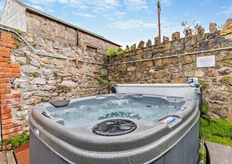 The enclosed garden & hot tub at 4 Queens Parade, Tenby
