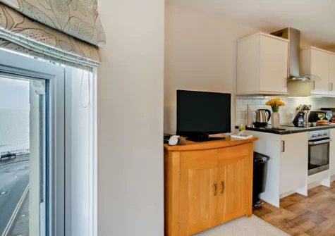 The living area & kitchen at 4 Spetchley House, Tenby