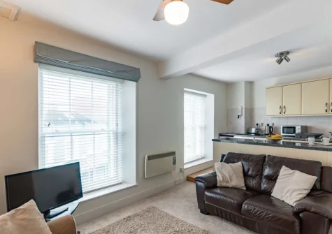 The living area & kitchen at 5 Cheltenham House, Tenby
