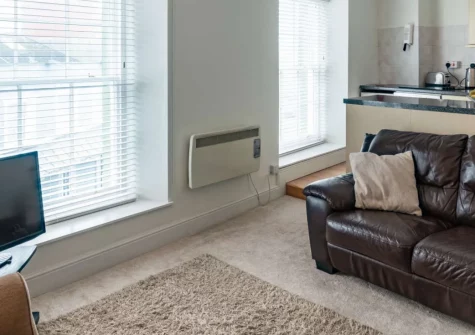 5 Cheltenham House, Tenby is a cosy two-bedroom apartment in the heart of this historic walled town, with lively views across Tudor Square, contemporary coastal interiors, and Tenby's golden beaches and harbour just moments from your door.