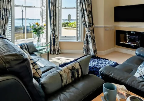 5 South Beach Court, Tenby is a stylish seafront apartment with breathtaking views across South Beach and towards Caldey Island. Perfect for families or couples seeking a Welsh coastal escape with easy beach access and abundant attractions nearby.