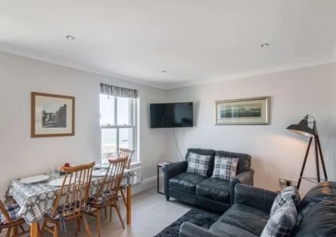The living & dining area at 6 Goscar Court, Tenby