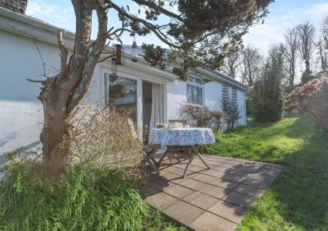 The patio, outdoor sitting area & garden at 7 Oakridge Acres, Tenby