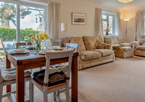 7 Oakridge Acres, Tenby is a charming three-bedroom bungalow nestled in peaceful countryside, moments from the seaside. With a dog-friendly garden and easy access to family attractions, it's perfect for creating treasured holiday memories.