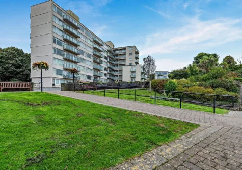 74 Croft Court is a stylish two-bedroom top floor apartment with stunning sea views