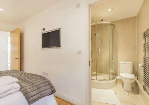 Bedroom #1 & en-suite shower room at 8 Cobourg House, Tenby