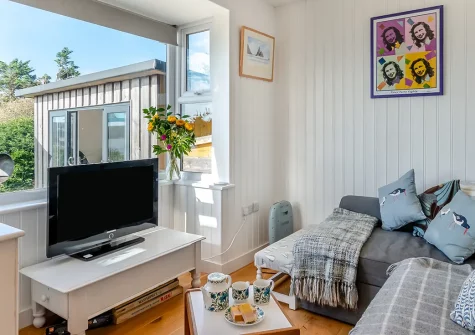 Aelfryn, Wisemans Bridge is a charming two-bedroom coastal cabin with spectacular sea views, cosy wood burner, and sun-soaked patio. Just steps from the beach, it offers the perfect escape for unforgettable seaside holidays and family adventures.