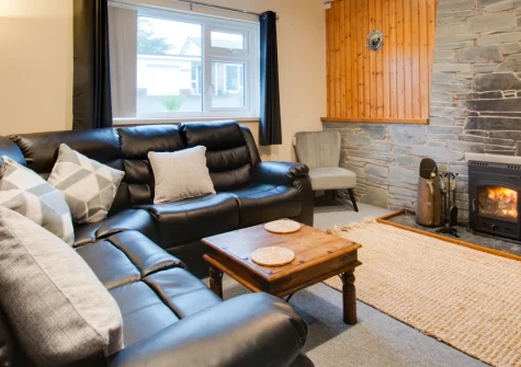 Ashwood, Saundersfoot is a spacious five-bedroom bungalow with separate garden annexe, set in peaceful surroundings just moments from the beach, with a cosy wood burner, generous wrap-around garden with multiple patios, and access to coastal walks.