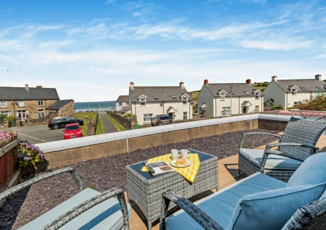 The patio garden & outdoor sitting area at Awel Y Môr, Broad Haven