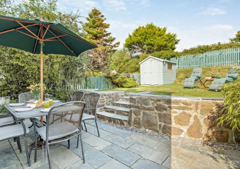 The patio, alfresco dining area & fully enclosed garden at Beach Haven, Broad Haven