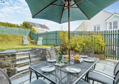 The patio, alfresco dining area & fully enclosed garden at Beach Haven, Broad Haven