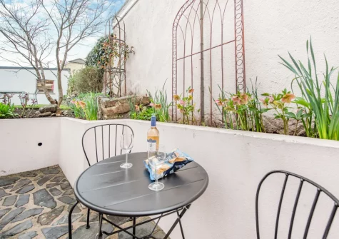 The rear patio & outdoor sitting area at Beech Tree Cottage, Saundersfoot