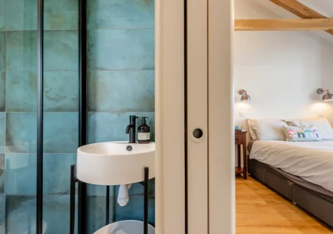 Bedroom #1 & en-suite shower room at Berry Cottage, Little Haven