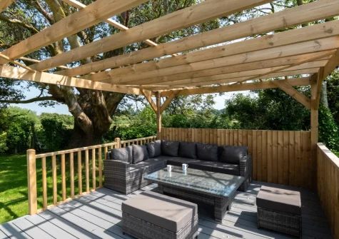 The decked patio & outdoor sitting area at Blochdy, Brynsiencyn