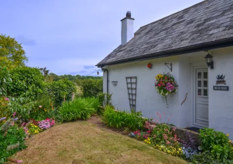 To the front of the cottage is a pretty garden