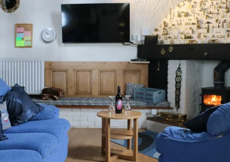 Blochdy, Brynsiencyn is a charming seventeenth-century cottage near the Menai Strait, offering a cosy wood burner, sunny garden room, games room, private garden and easy access to Anglesey's beaches, Snowdonia views and Beaumaris castle.
