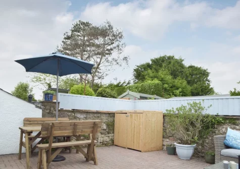 The courtyard garden & alfresco dining area at Bluebell House, Tenby