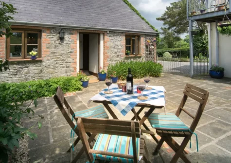 The enclosed private patio, barbecue & alfresco dining area at Bridge Cottage, Cresselly
