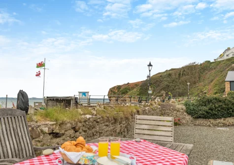 The patio & alfresco dining area, boasting incredible sea views, at Bridge House, Little Haven