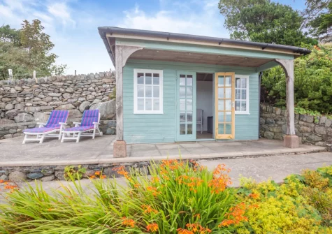 The summerhouse, patio & outdoor sitting area at Bron Y Gadair, Llanfair
