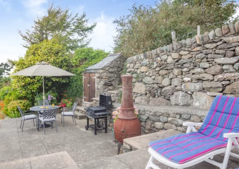 The patio, barbecue, alfresco dining & outdoor sitting area at Bron Y Gadair, Llanfair