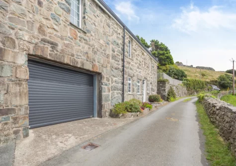 Bron Y Gadair has rivate parking for one car & one small car in the garage