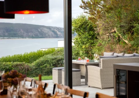 The patio & alfresco dining area at Bryn Benar, Abersoch