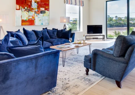 Bryn Benar, Abersoch is a stunning six-bedroom coastal home on the Benar headland, boasting panoramic sea views across Cardigan Bay, a games room with pool table, and direct access to Abersoch's harbour and beaches from the doorstep.