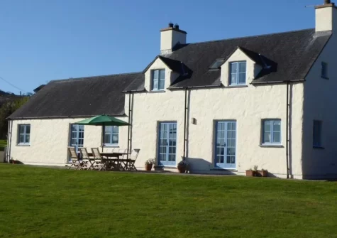The patio, alfresco dining area & large lawned wraparound garden at Brynceirios, Newport