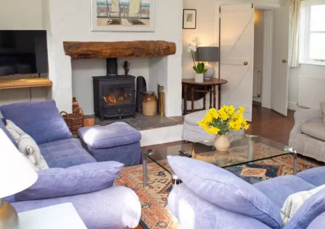 Brynceirios, Newport is a spacious four-bedroom cottage overlooking the beautiful Nevern Estuary and Newport beach, featuring a large garden with spectacular coastal views, traditional Pembrokeshire character, and the Coast Path just moments away.