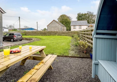 The alfresco dining area & spacious enclosed lawned garden at Bryncoed, Narberth