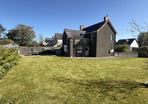The spacious enclosed lawned garden at Bryncoed, Narberth