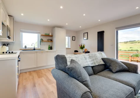 The living area & kitchen at Bryniau Pair Ucha Cottage, Pandy Tudur