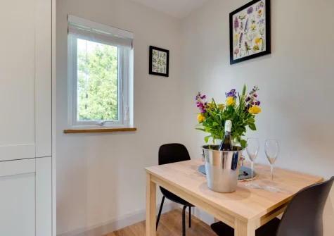 The dining area at Bryniau Pair Ucha Cottage, Pandy Tudur