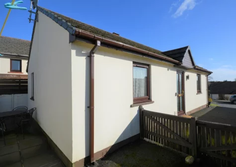 The enclosed rear patio courtyard & outdoor sitting area at Buttercup Cottage, Kilgetty