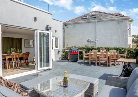 The patio, barbecue, alfresco dining & outdoor sitting area at Bwthyn Craig Wen, Mynytho