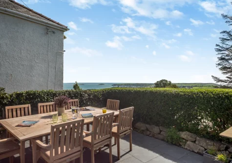 The patio, barbecue & alfresco dining area at Bwthyn Craig Wen, Mynytho
