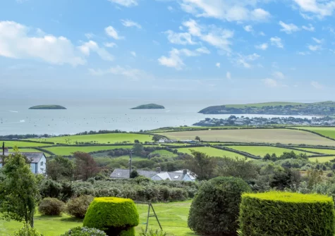 Enjoy fantastic views across Abersoch Bay towards St Tudwal's Island when you stay at Bwthyn Craig Wen, Mynytho