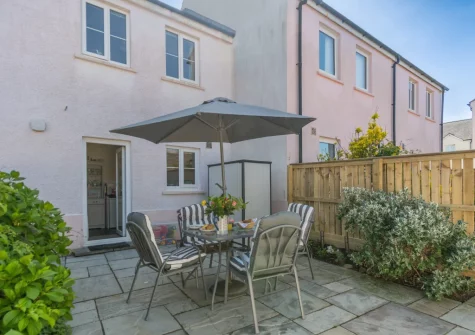 The fully enclosed patio garden & alfresco dining area at Bwthyn Y Mor, Broad Haven
