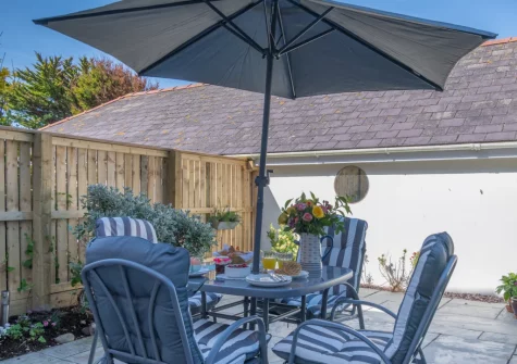 The fully enclosed patio garden & alfresco dining area at Bwthyn Y Mor, Broad Haven